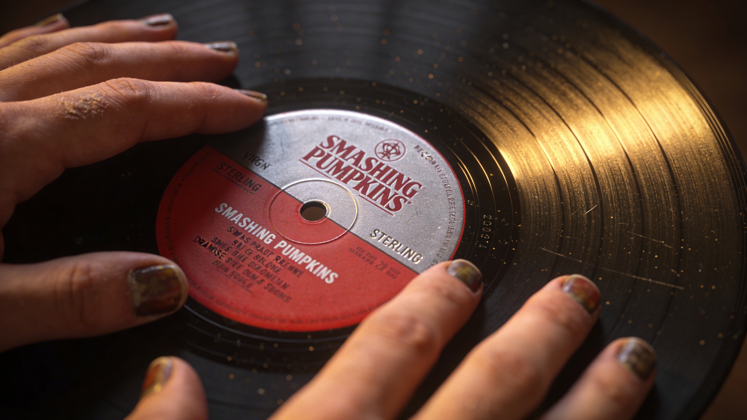 Photorealistic: Close-up of original Virgin Records Siamese Dream vinyl label with detailed matrix numbers visible, warm tungsten lighting, shallow focus on the center label, surrounding vinyl surface