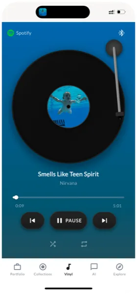 VinylAI vinyl player view showing Nirvana Smells Like Teen Spirit with turntable animation and Spotify connection
